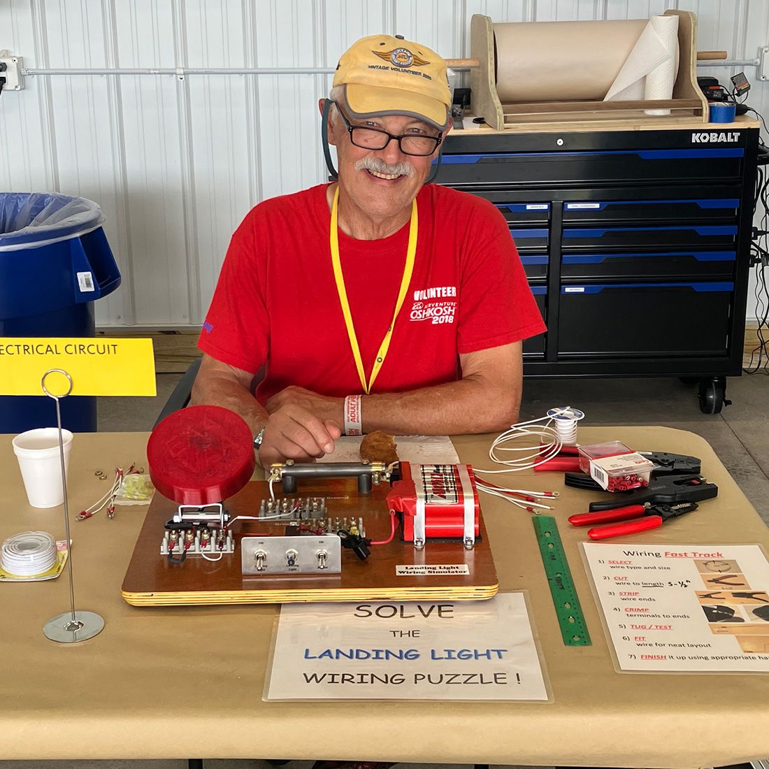 darrel at a table with a wiring puzzle