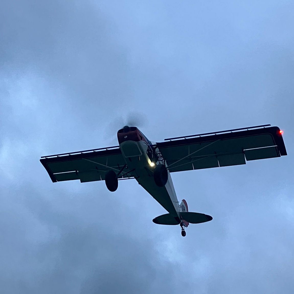 plane against cloudy sky in stol competition